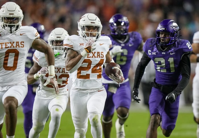 Texas Longhorns running back Jonathon Brooks (24) runs for the first down against TCU Horned Frogs in the first quarter of an NCAA college football game, Saturday, November. 11, 2023, at Amon G. Carter Stadium